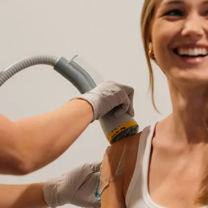 A provider at Galbraith Chiropractic Associates using the SoftWave device